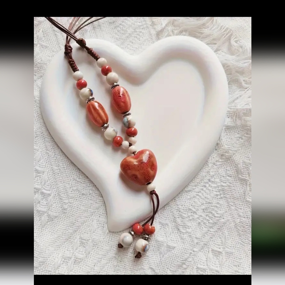 Boho-Chic Handcrafted Ceramic Necklace with Colorful Beads.